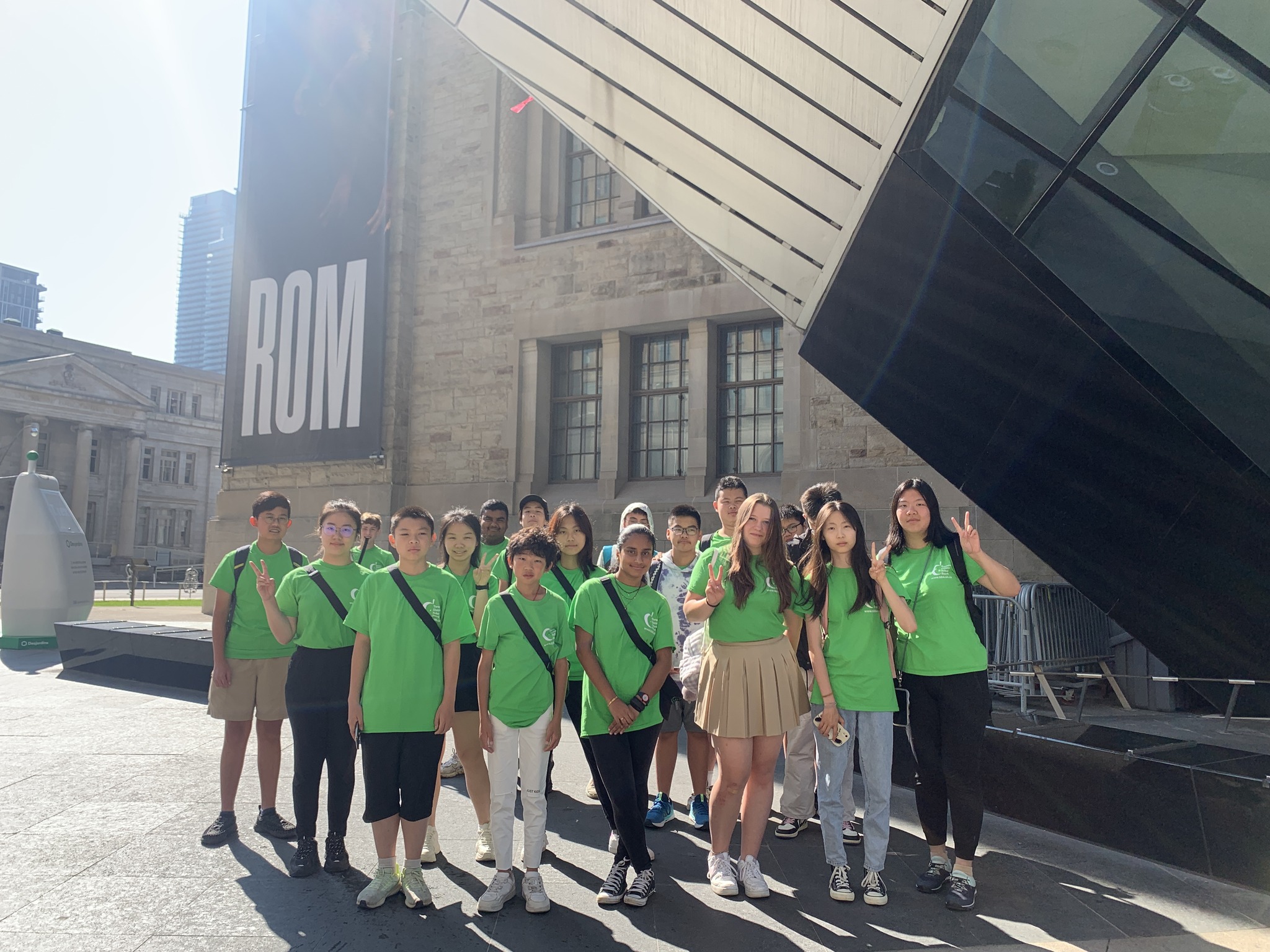 Group photo of students standing in front of the ROM Open Gallery